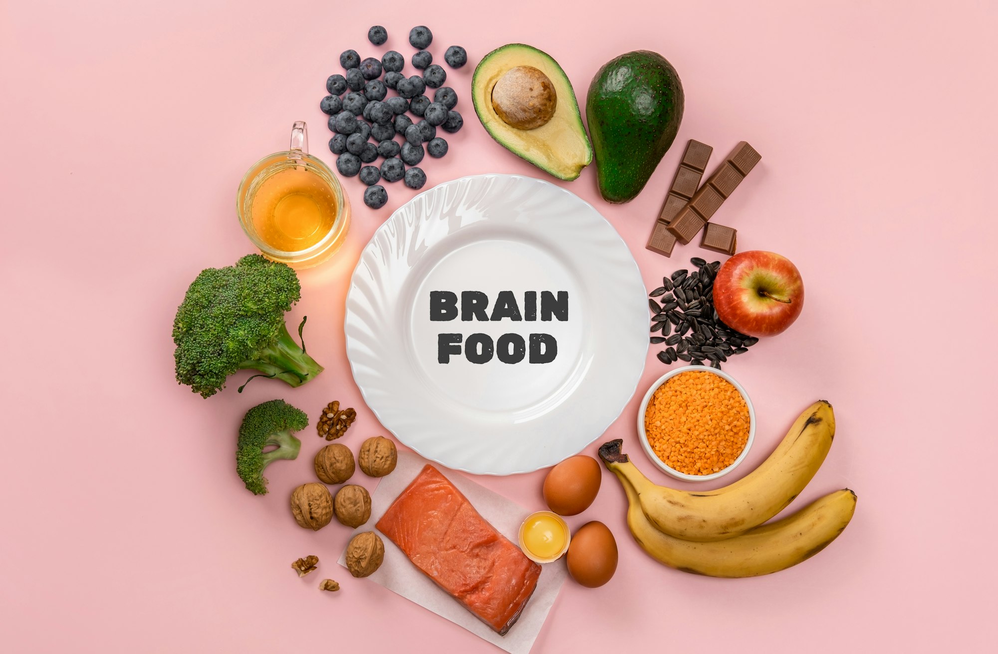 Best foods for brain and memory on pink background. Food for mind and charge of energy.