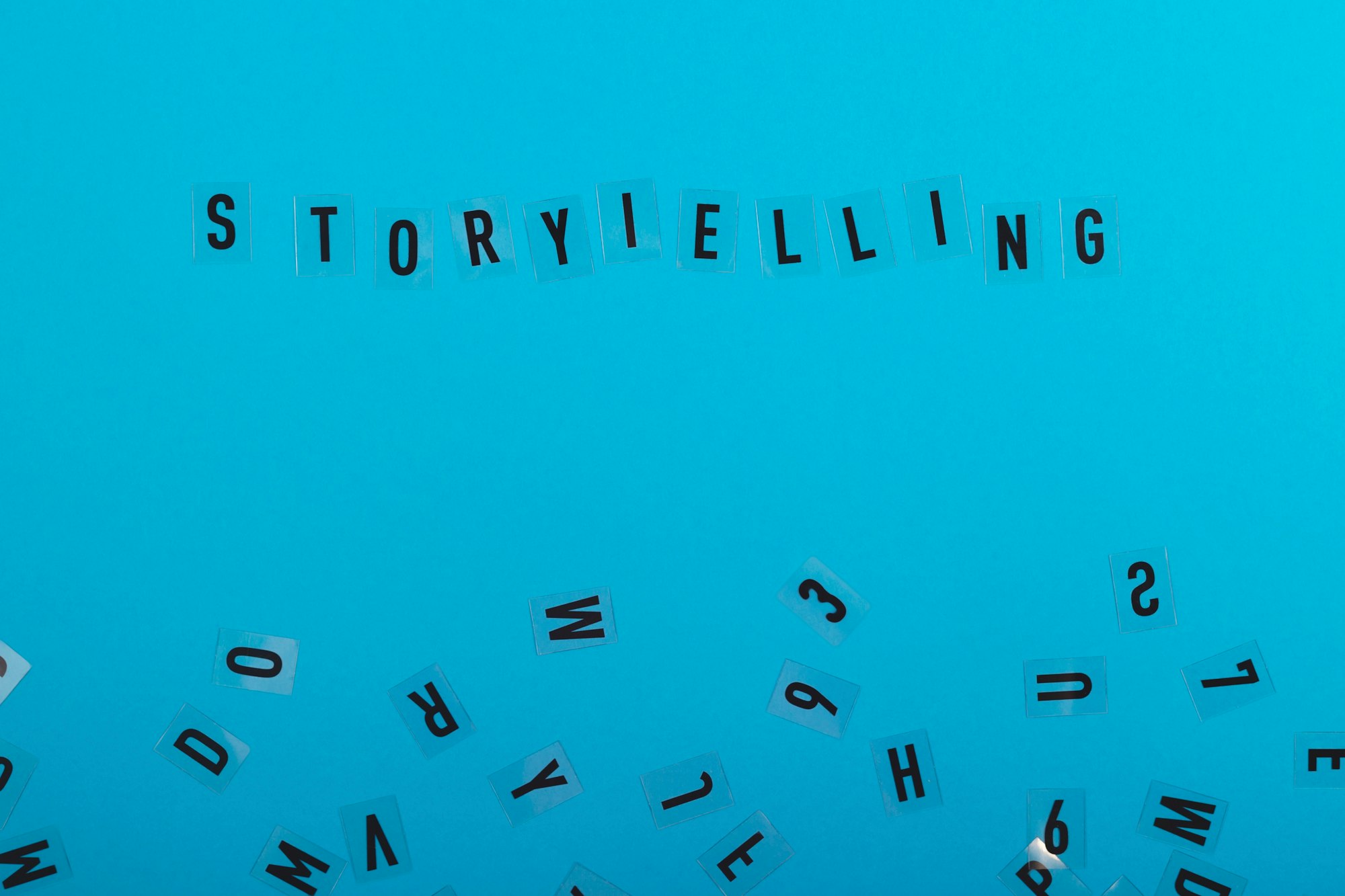 Storytelling is written on a light blue background among black letters. Marketing and content